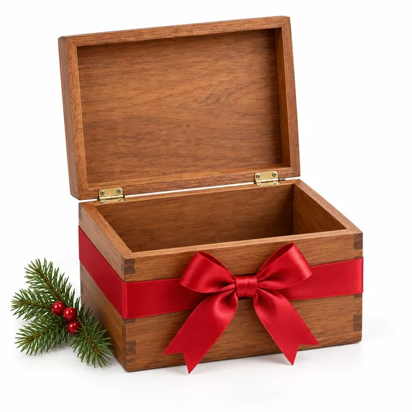 An open wooden keepsake box tied with a red satin bow