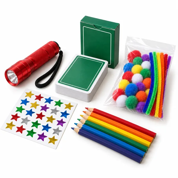 A red flashlight, playing cards, a pom pom craft kit, star stickers and colored pencils